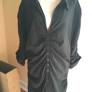 Black stretch blouse by eci New York. Gathered front with fixed buttons.